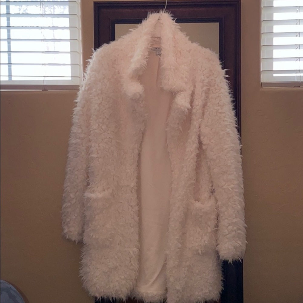 White furry coat